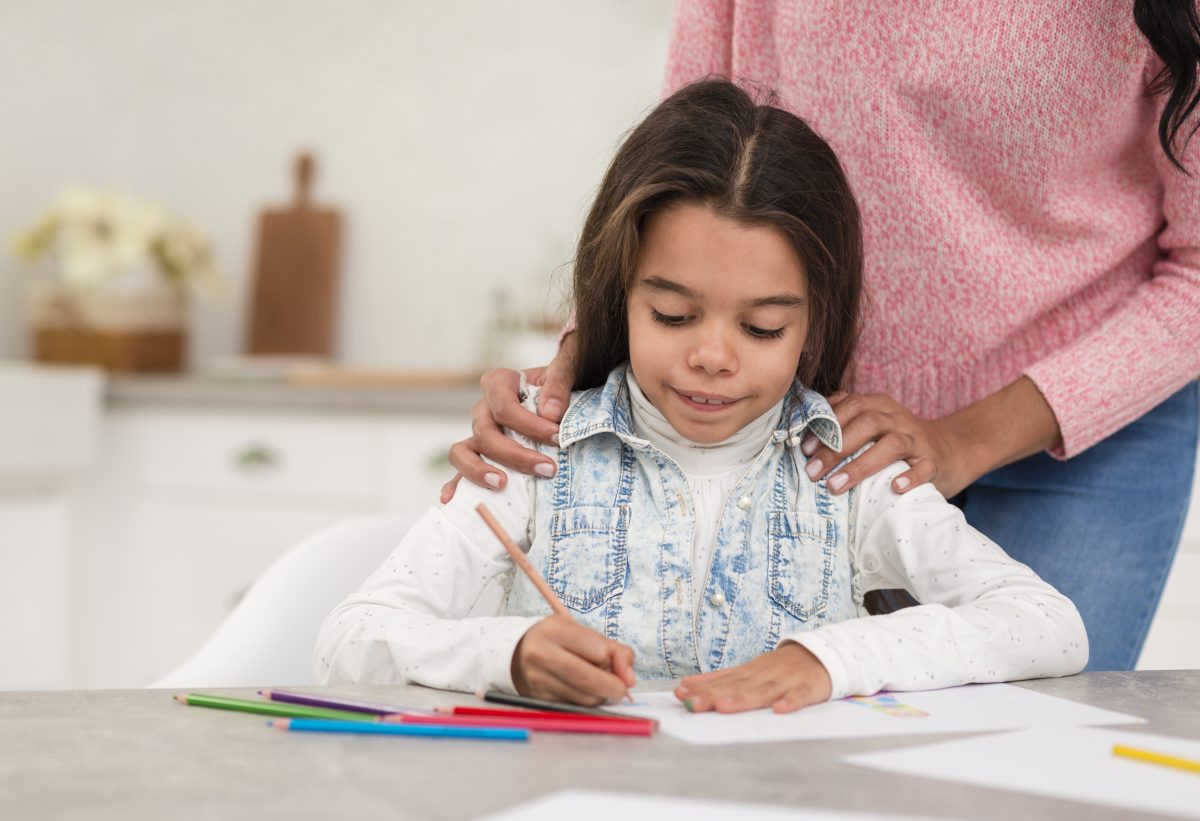 mom helping daugther with lecture